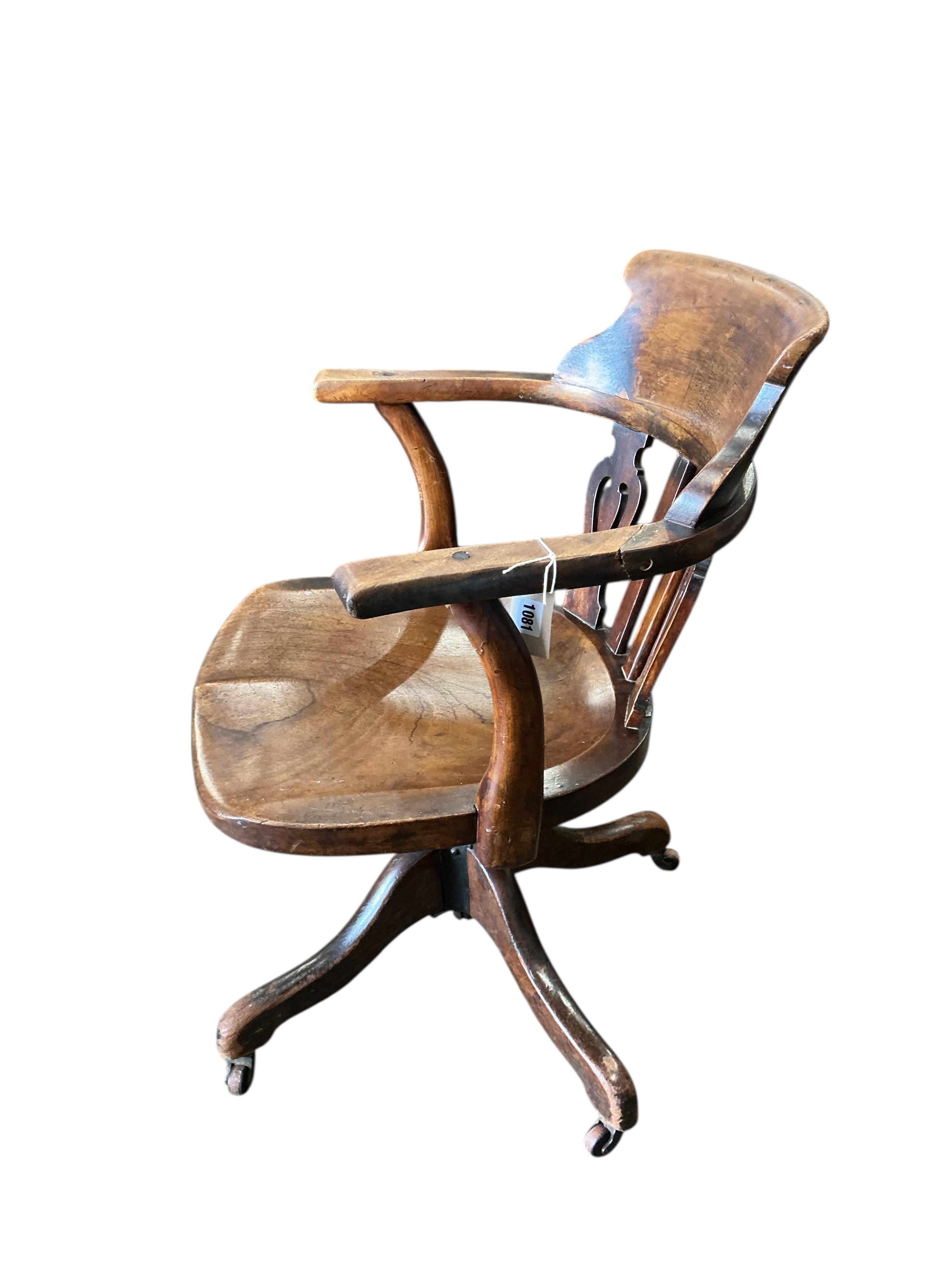 A Victorian mahogany swivel desk chair with saddle seat, width 59cm, depth 48cm, height 81cm